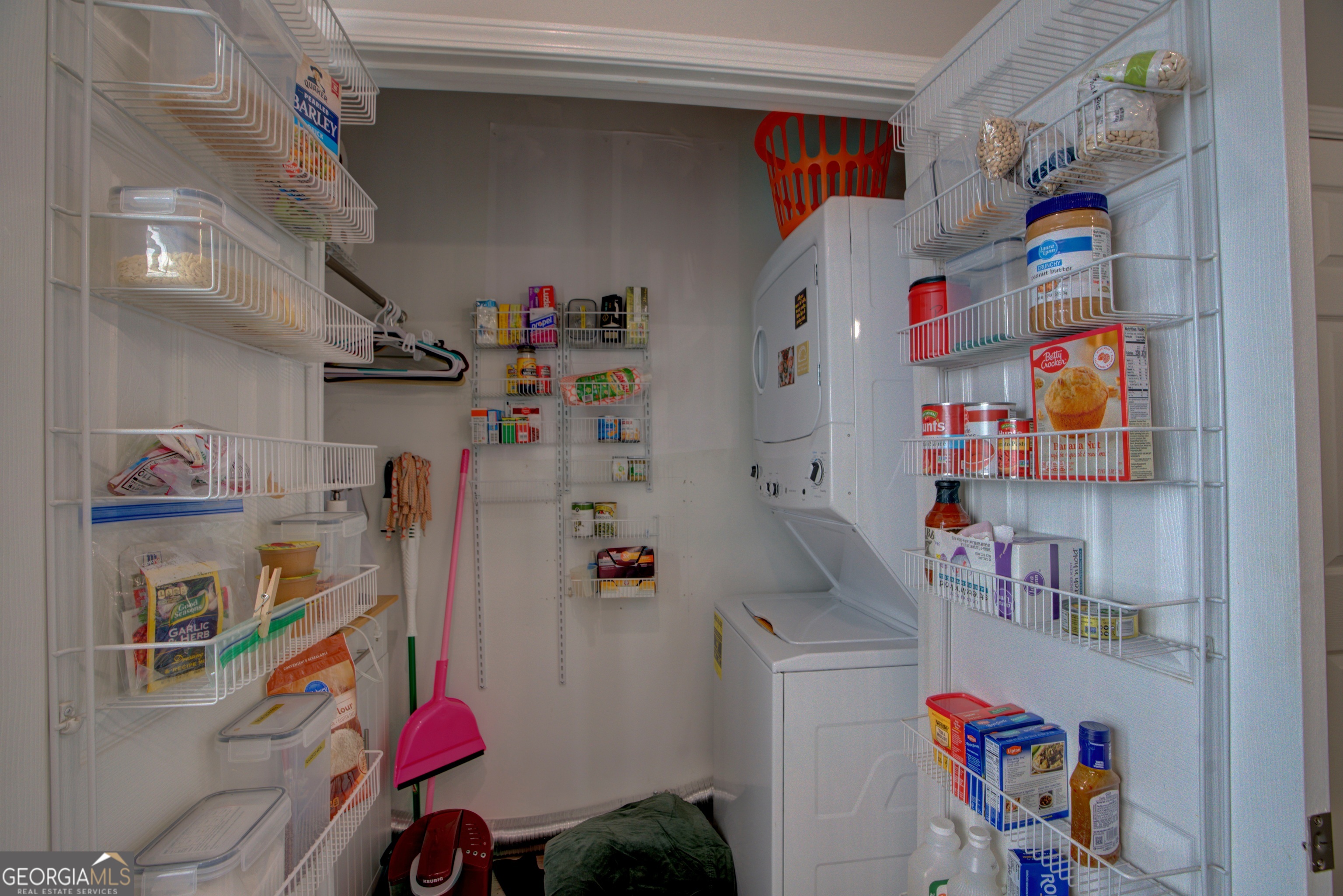 814 Manor Way Cartersville, GA 30120 - Photo 21 of 24 a utility room with fridge and a wooden floor