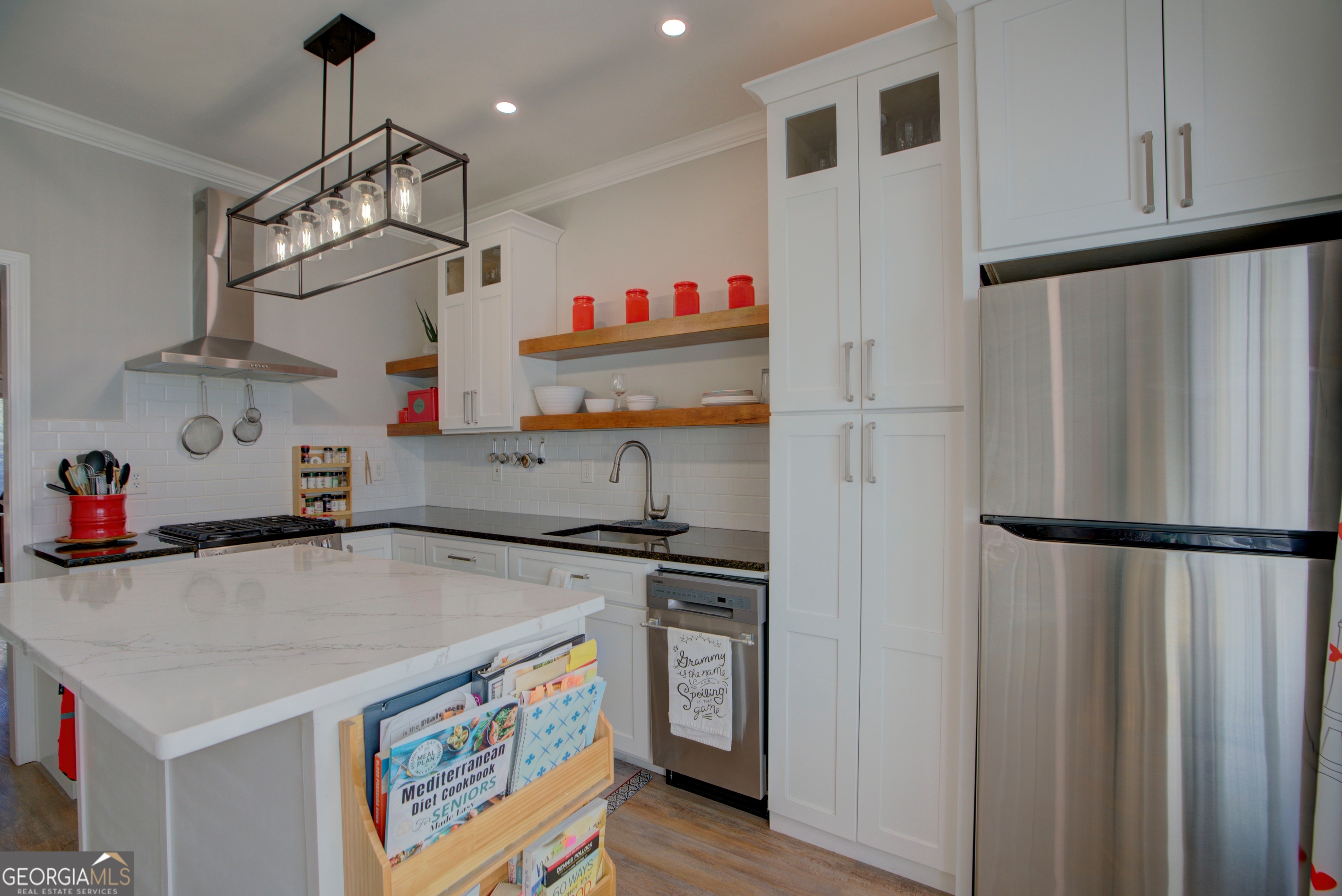 814 Manor Way Cartersville, GA 30120 - Photo 6 of 24 a kitchen with stainless steel appliances a refrigerator and a stove top oven