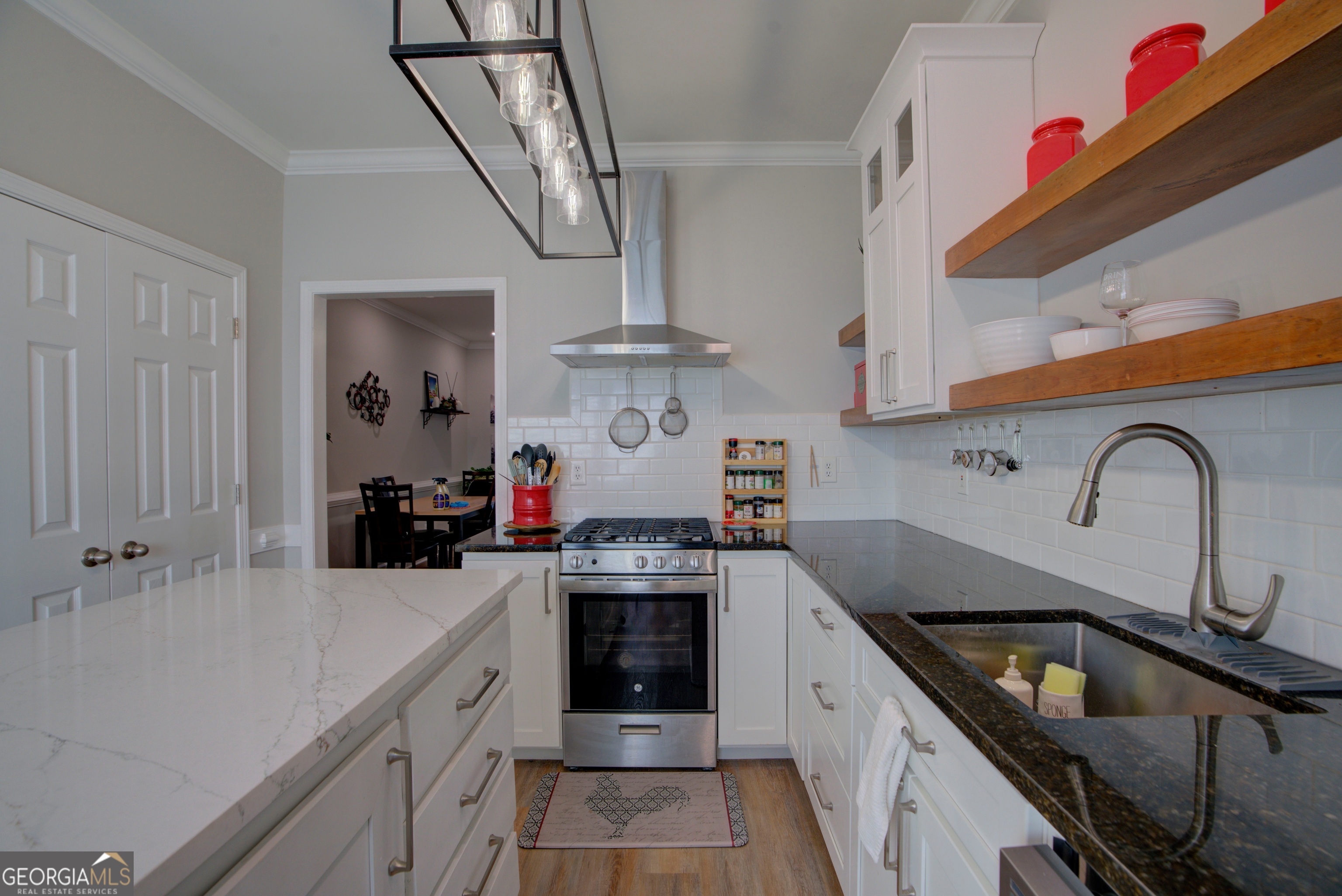 814 Manor Way Cartersville, GA 30120 - Photo 7 of 24 a kitchen with stainless steel appliances granite countertop a sink stove and cabinets