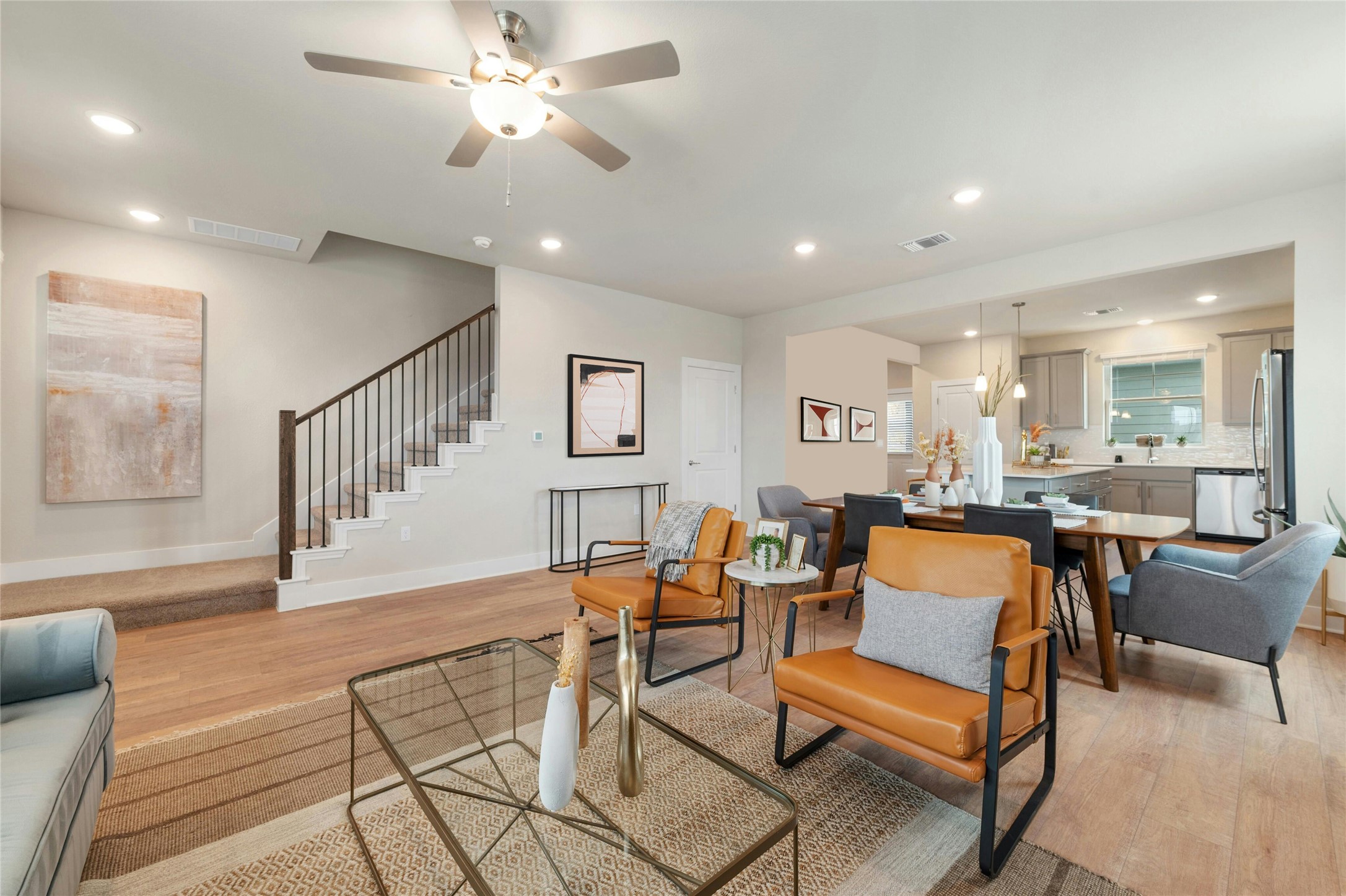 5804 Rotunda View Austin, TX 78747 - Photo 5 of 27 An open-concept living space integrates a casual dining area and a functional kitchen, all anchored by warm wood flooring.