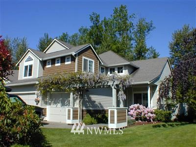 4310 Northeast 7th Street Renton, WA 98059 - Photo 1 of 1 a front view of a house with a yard