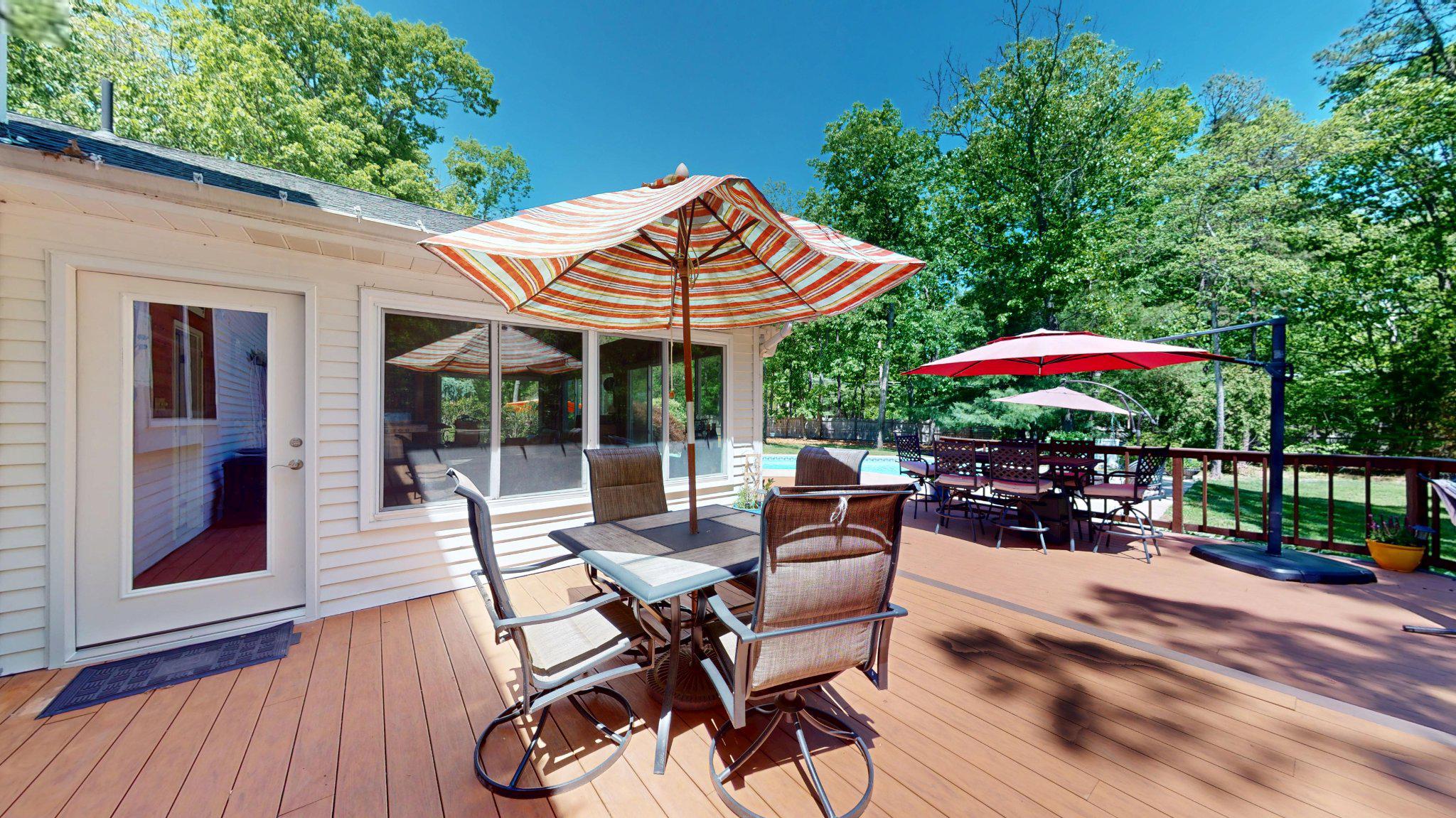 3 Colonial Court Medford, NJ 08055 - Photo 73 of 89 Sunny deck with vibrant umbrellas.