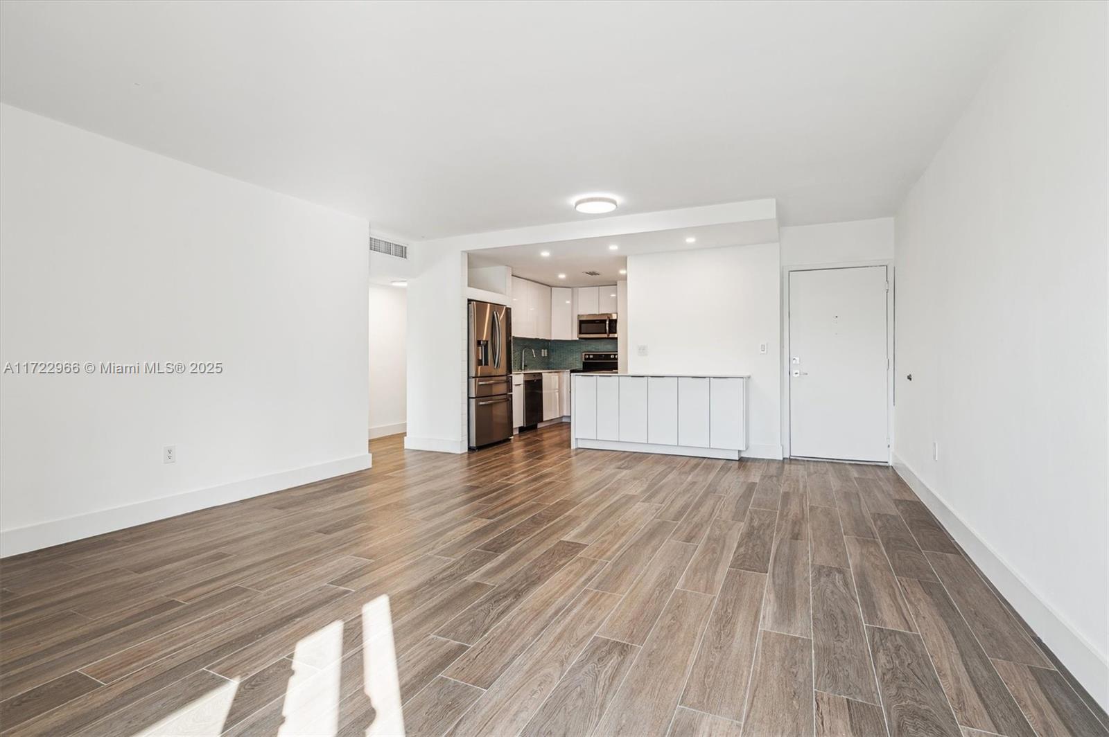 301 Sunrise Drive, Unit 3AW Key Biscayne, FL 33149 - Photo 16 of 23 a view of a kitchen with wooden floor