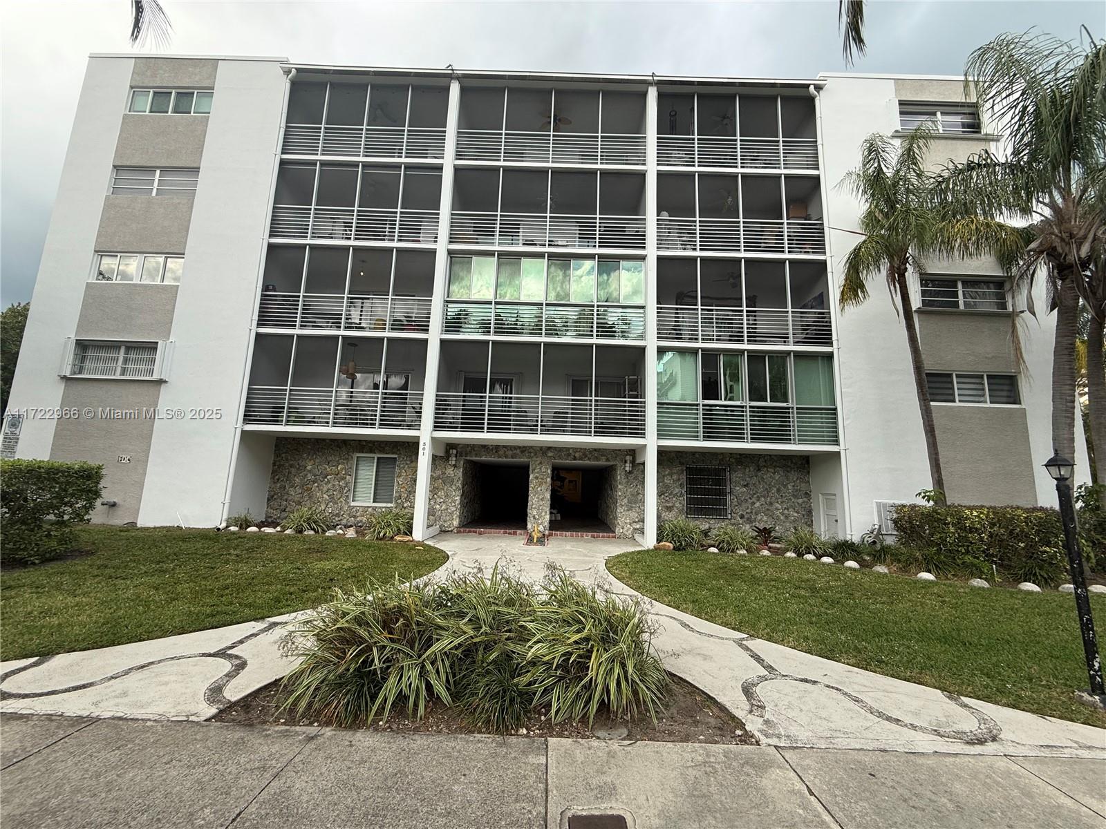 301 Sunrise Drive, Unit 3AW Key Biscayne, FL 33149 - Photo 23 of 23 a front view of a house with a yard