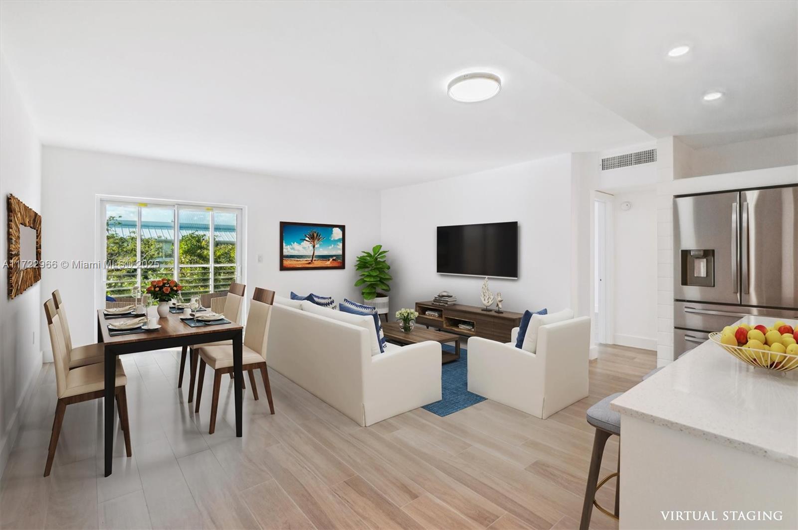301 Sunrise Drive, Unit 3AW Key Biscayne, FL 33149 - Photo 3 of 23 a living room with furniture a flat screen tv and a large window