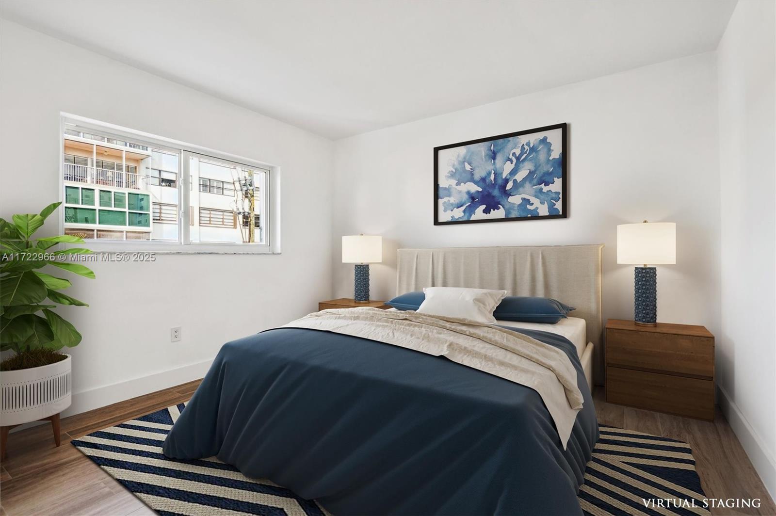 301 Sunrise Drive, Unit 3AW Key Biscayne, FL 33149 - Photo 10 of 23 a bedroom with a bed and wooden floor