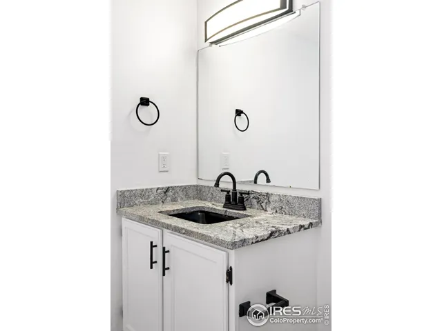 a bathroom with a sink and mirror