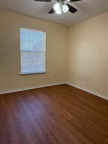 a view of wooden floor in an empty room