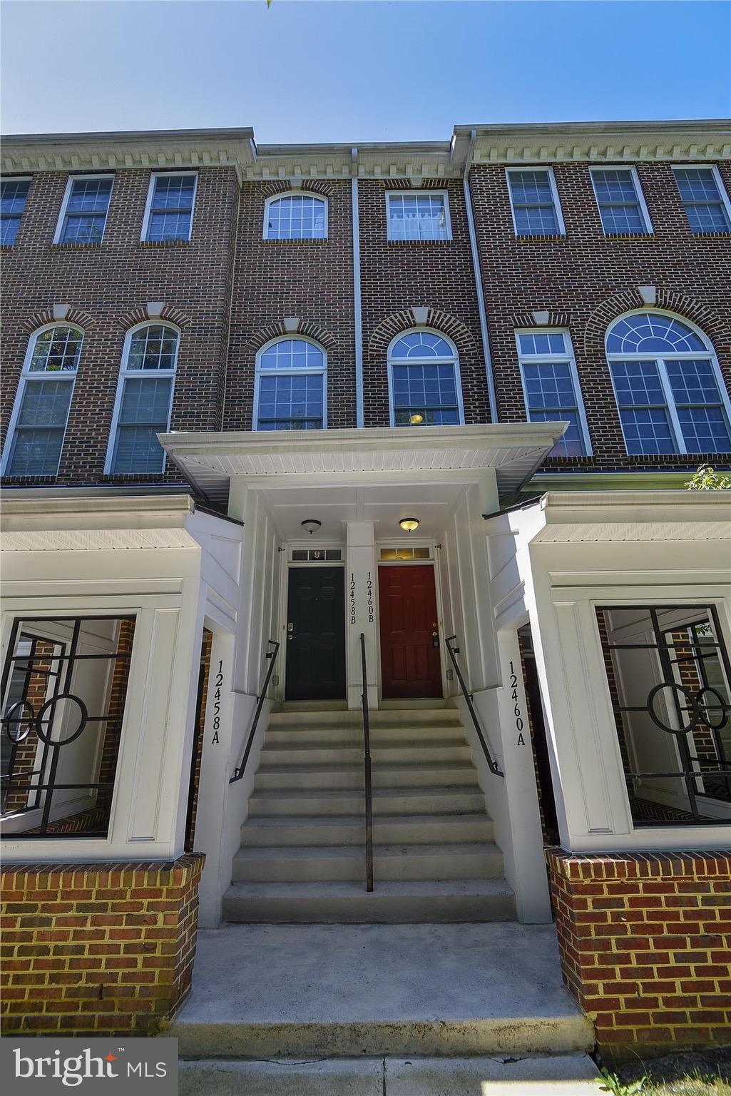 12460 Liberty Bridge Road, Unit 106B Fairfax, VA 22033 - Photo 1 of 30 Front entrance to townhouse-style condo