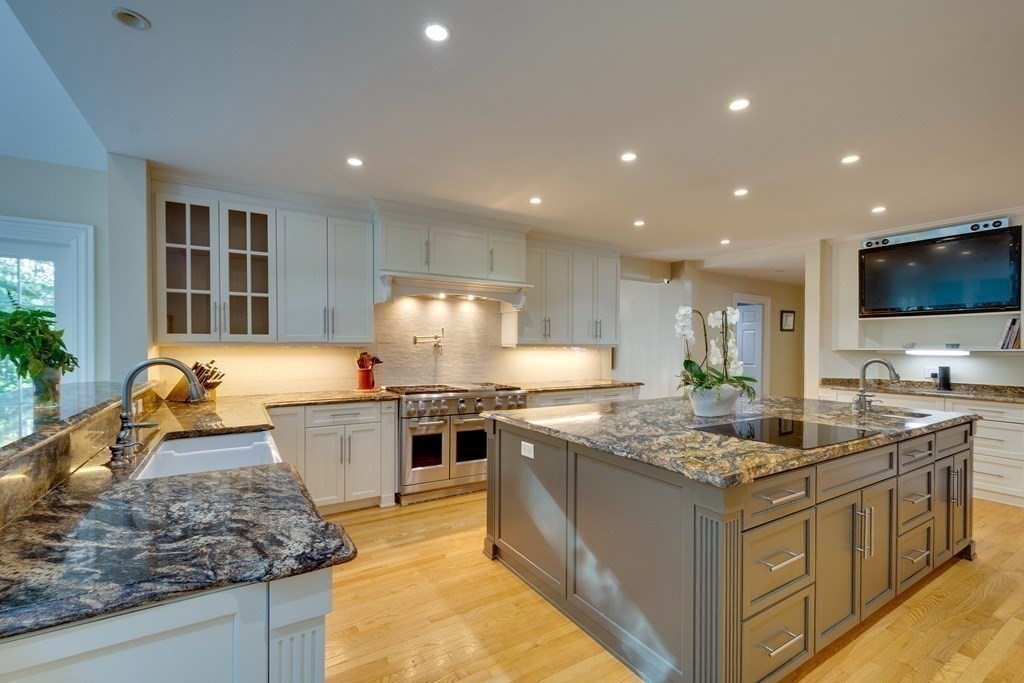 63 Brook Street Wellesley, MA 02482 - Photo 13 of 41 a kitchen with stainless steel appliances granite countertop a stove oven and a sink with granite countertops