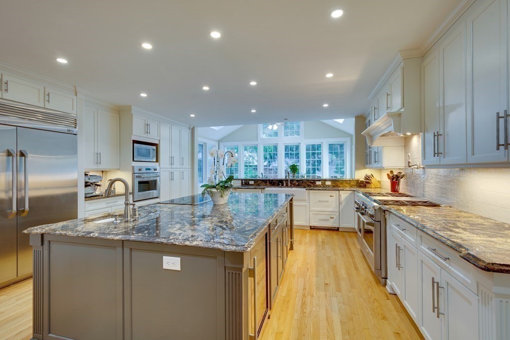 63 Brook Street Wellesley, MA 02482 - Photo 14 of 41 a kitchen with stainless steel appliances granite countertop a sink stove and refrigerator