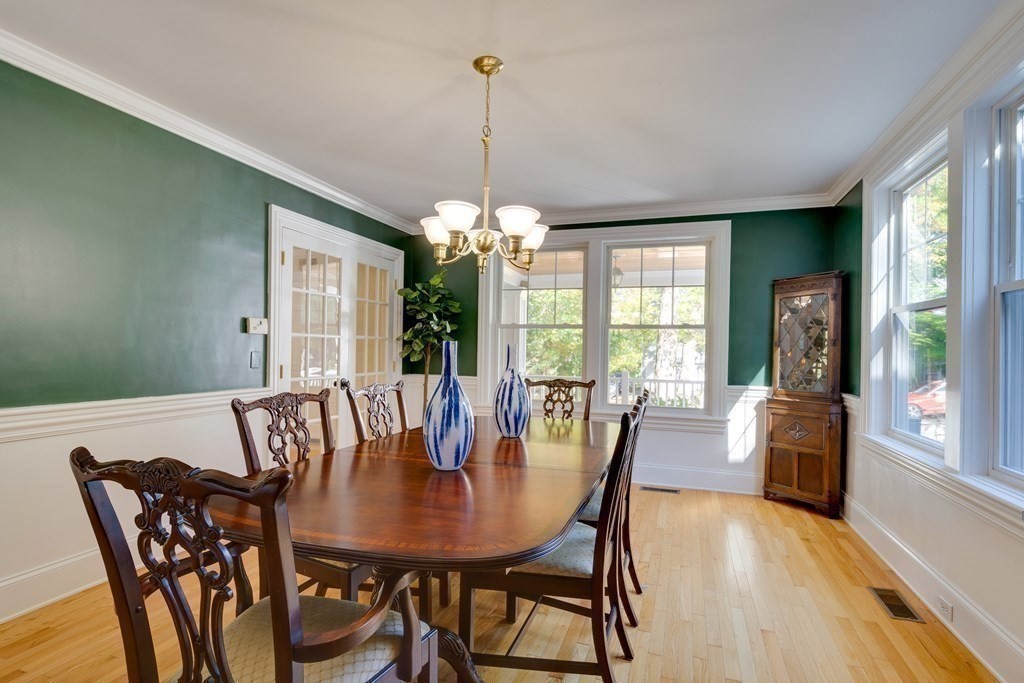 63 Brook Street Wellesley, MA 02482 - Photo 16 of 41 a view of a dining room with furniture window and wooden floor