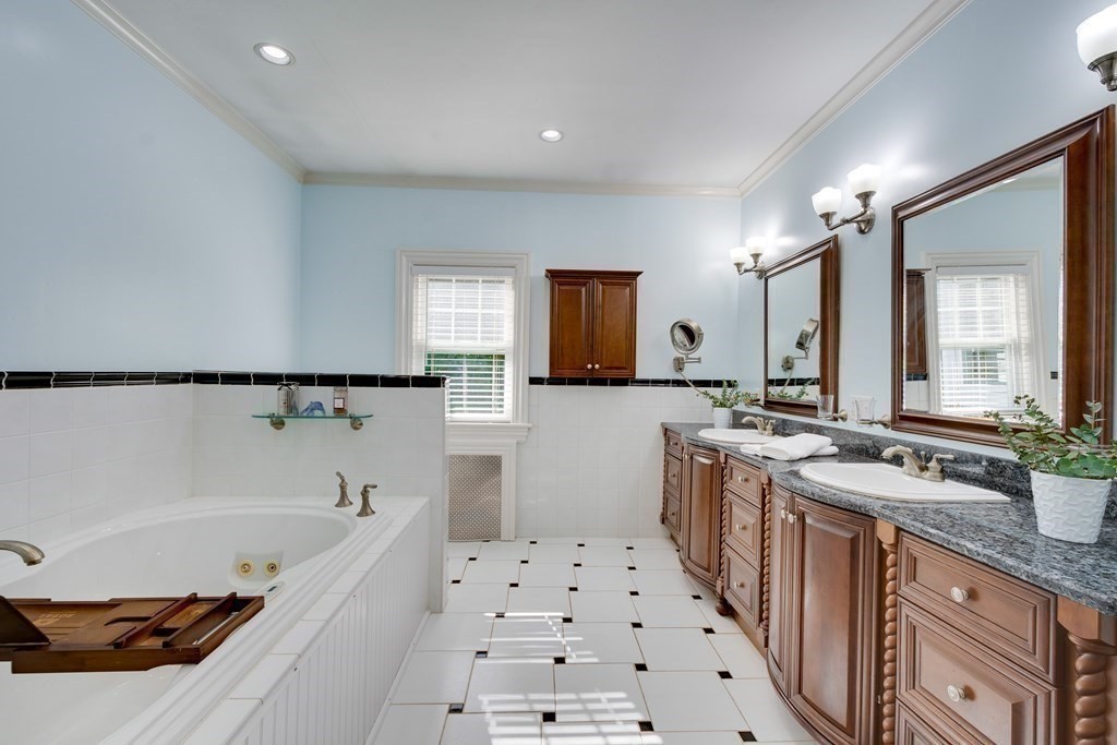63 Brook Street Wellesley, MA 02482 - Photo 26 of 41 a spacious bathroom with sink a mirror a bathtub and shower