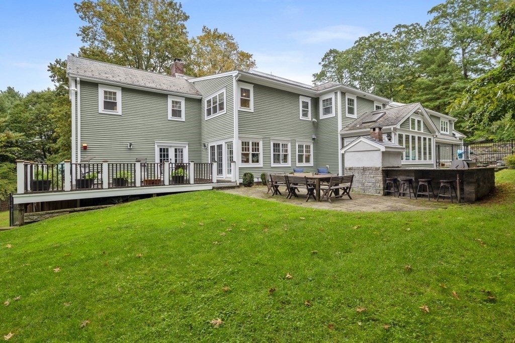 63 Brook Street Wellesley, MA 02482 - Photo 3 of 41 a front view of house with yard and seating area