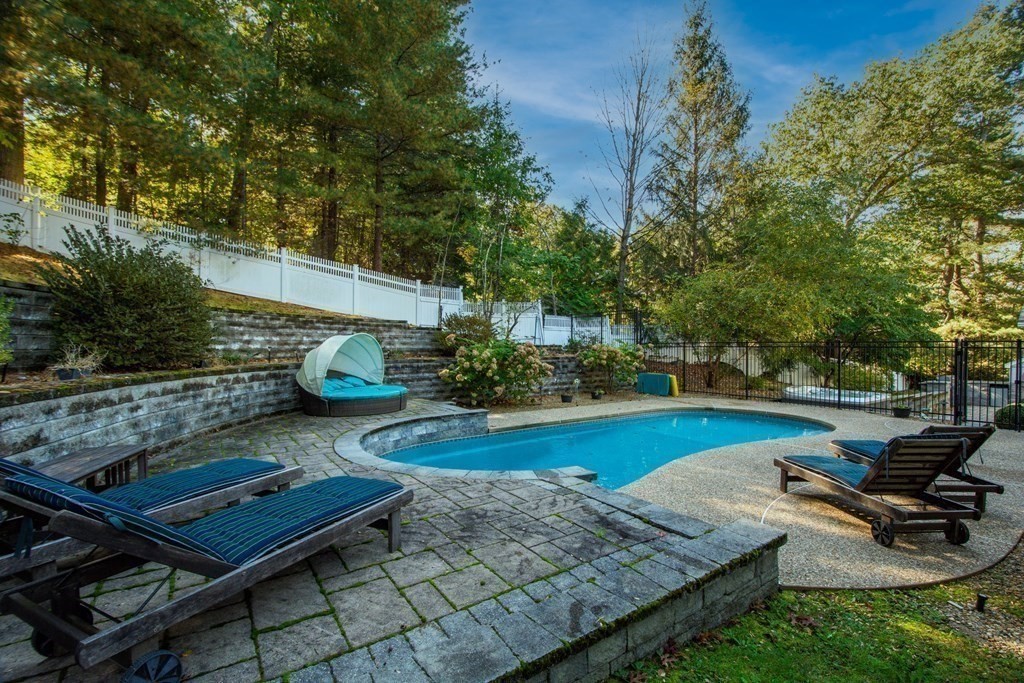 63 Brook Street Wellesley, MA 02482 - Photo 36 of 41 a view of a backyard with chairs and potted plants