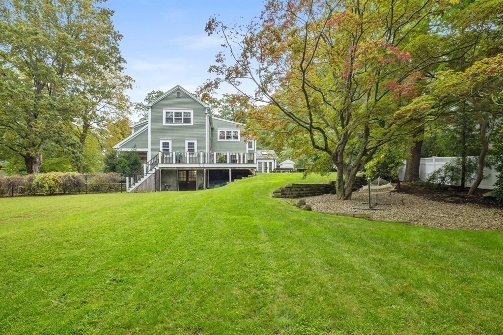 63 Brook Street Wellesley, MA 02482 - Photo 41 of 41 a view of a house with a big yard and large trees