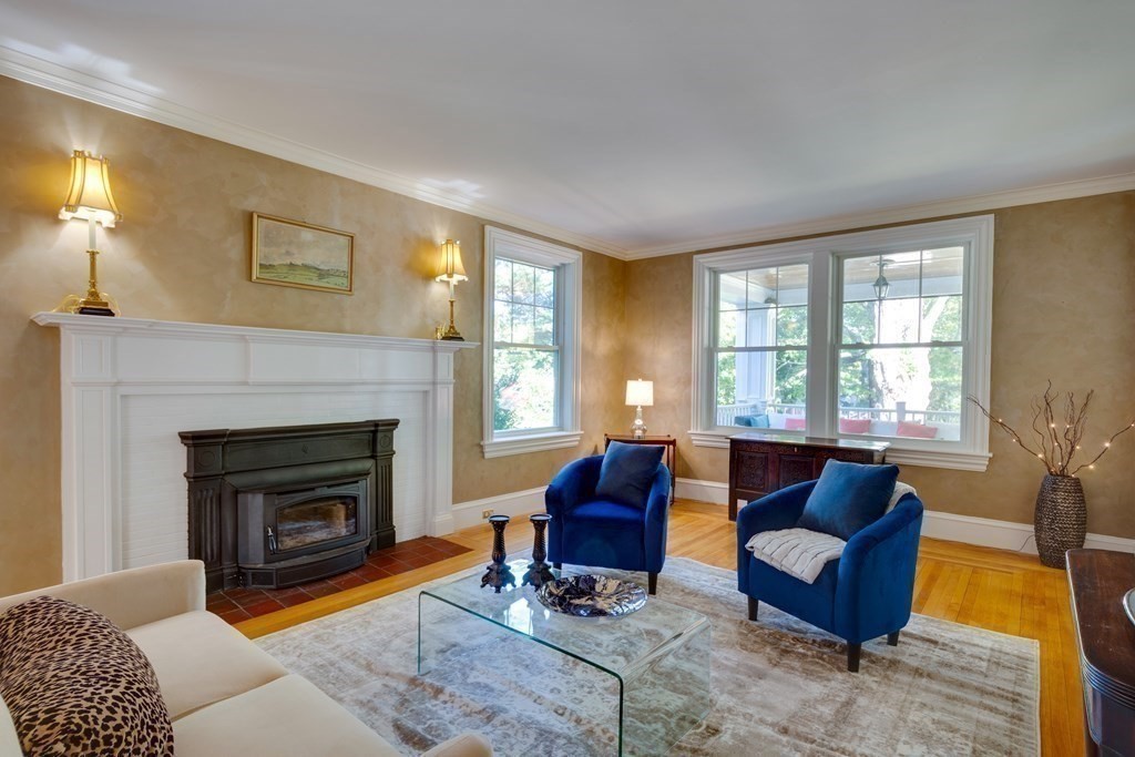 63 Brook Street Wellesley, MA 02482 - Photo 7 of 41 a living room with furniture and a fireplace