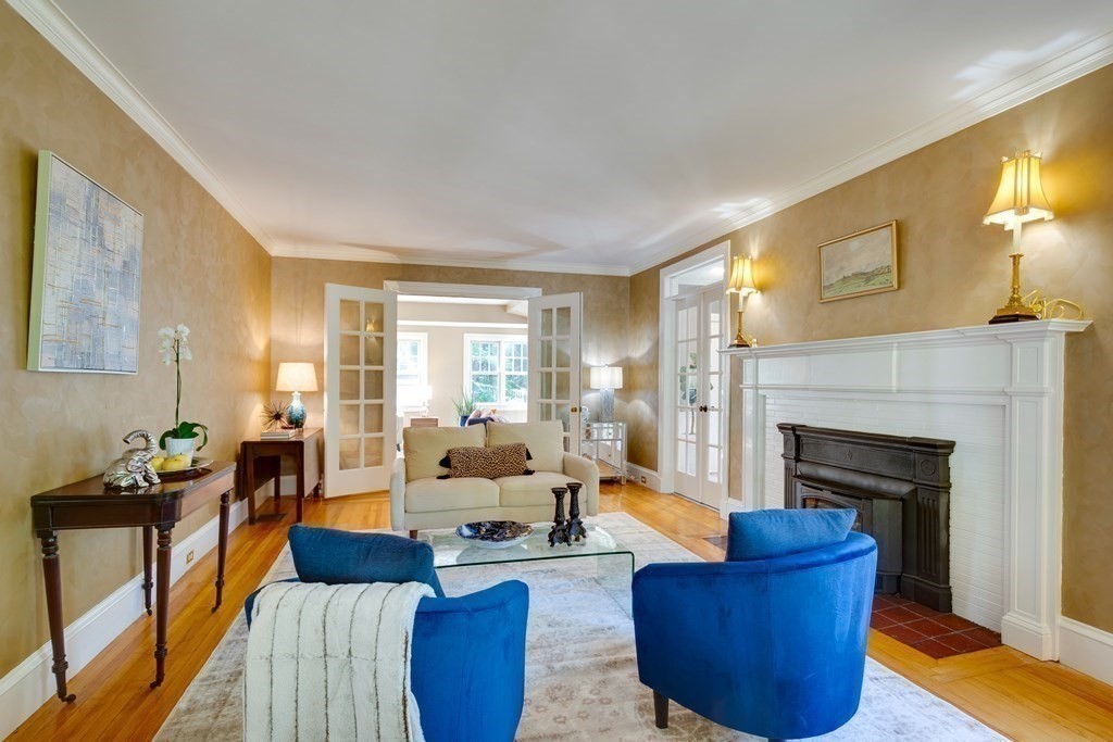 63 Brook Street Wellesley, MA 02482 - Photo 8 of 41 a living room with furniture and a fireplace