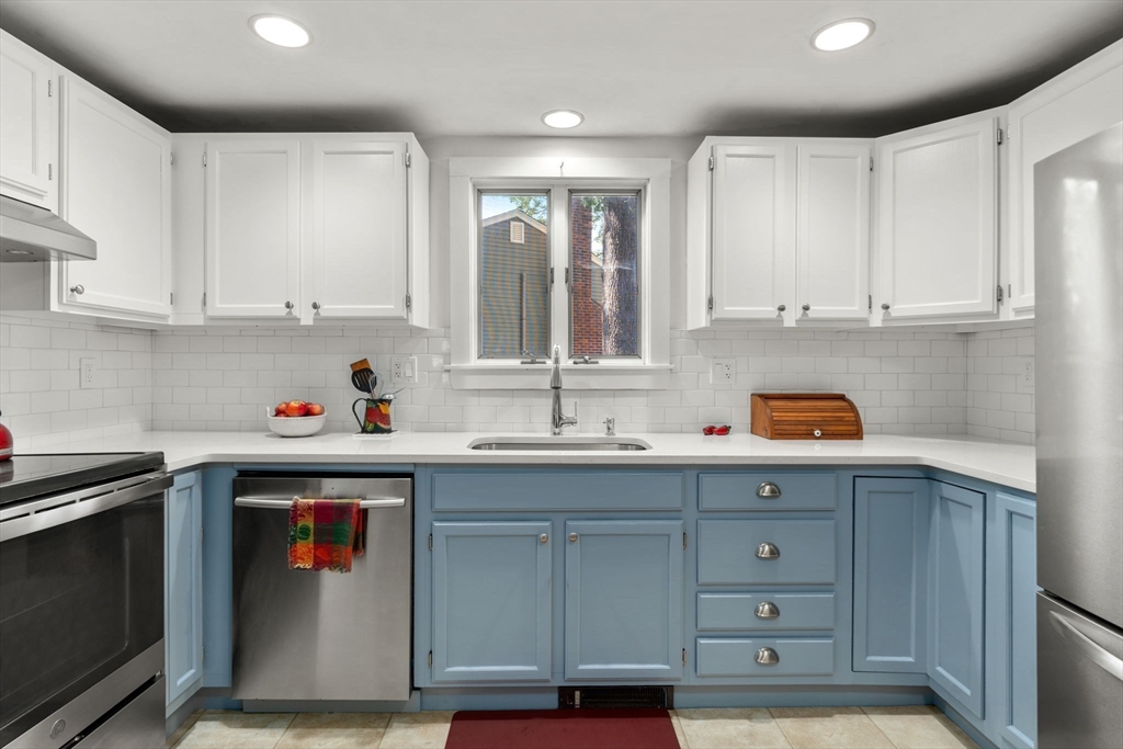 10 Prospect Street Maynard, MA 01754 - Photo 11 of 34 a kitchen with stainless steel appliances granite countertop a sink window and cabinets