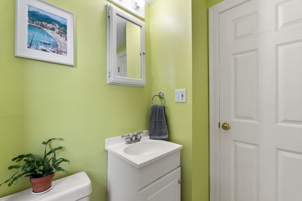 10 Prospect Street Maynard, MA 01754 - Photo 14 of 34 a bathroom with a sink mirror and vanity