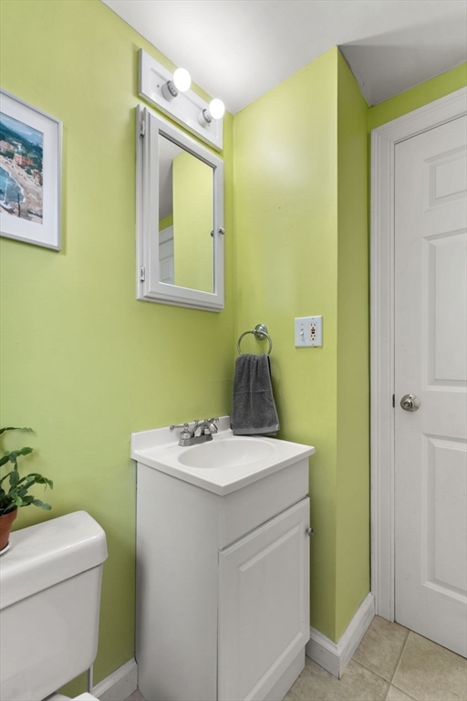 10 Prospect Street Maynard, MA 01754 - Photo 15 of 34 a bathroom with a toilet sink and mirror