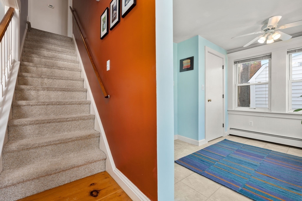 10 Prospect Street Maynard, MA 01754 - Photo 17 of 34 a view of an entryway with wooden floor and staircase