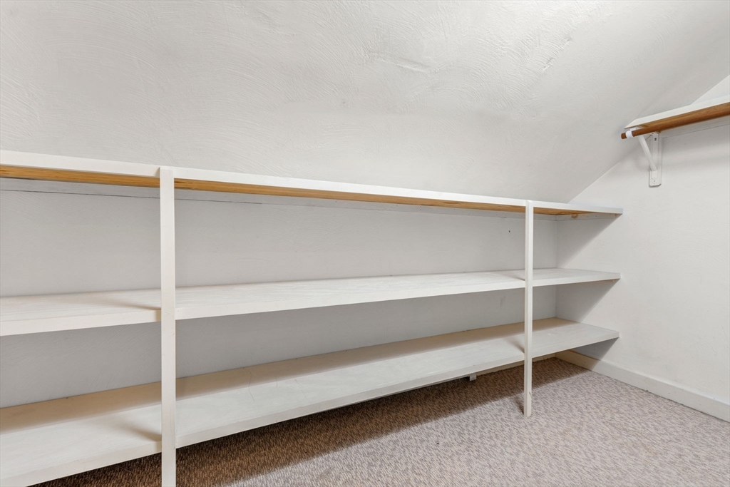 10 Prospect Street Maynard, MA 01754 - Photo 20 of 34 a view of walk in closet with empty racks