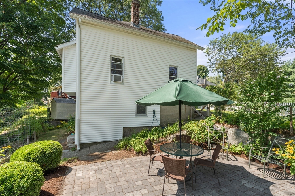 10 Prospect Street Maynard, MA 01754 - Photo 28 of 34 a patio with a patio table and chairs