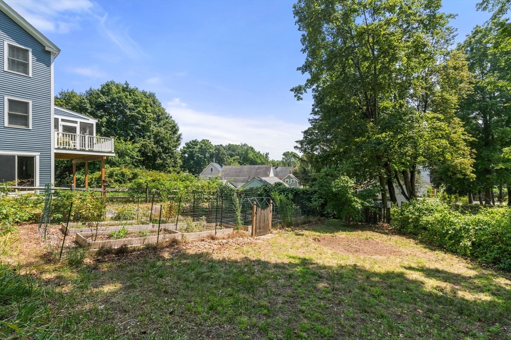 10 Prospect Street Maynard, MA 01754 - Photo 32 of 34 a backyard of a house with table and chairs