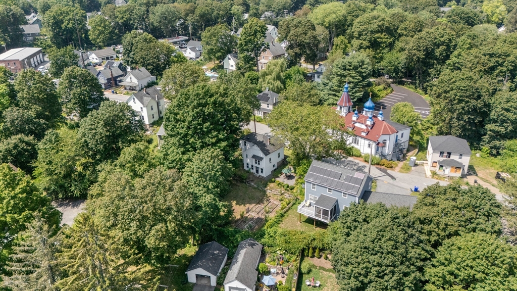 10 Prospect Street Maynard, MA 01754 - Photo 34 of 34 an aerial view of residential houses with outdoor space and trees