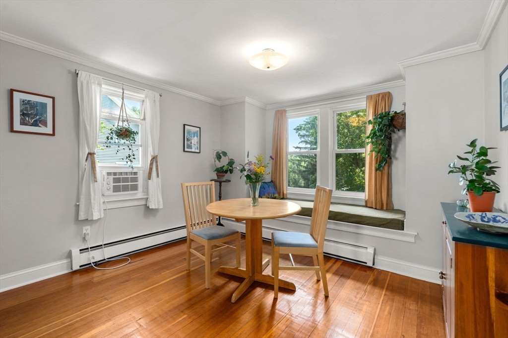 10 Prospect Street Maynard, MA 01754 - Photo 8 of 34 a dining room with furniture and wooden floor