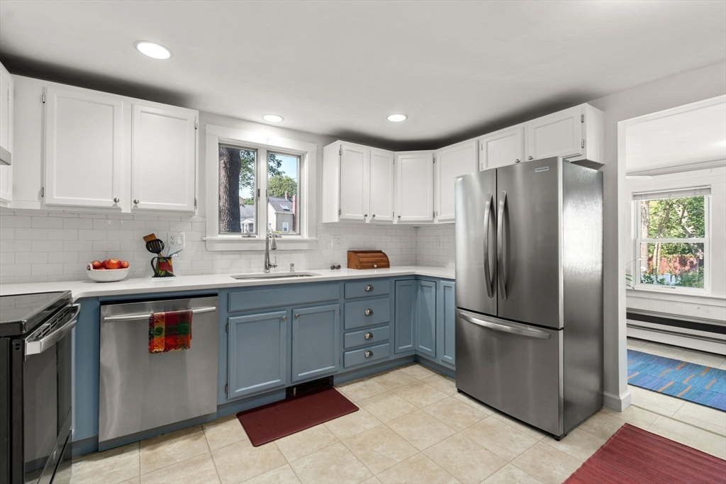 10 Prospect Street Maynard, MA 01754 - Photo 10 of 34 a kitchen with refrigerator cabinets and furniture