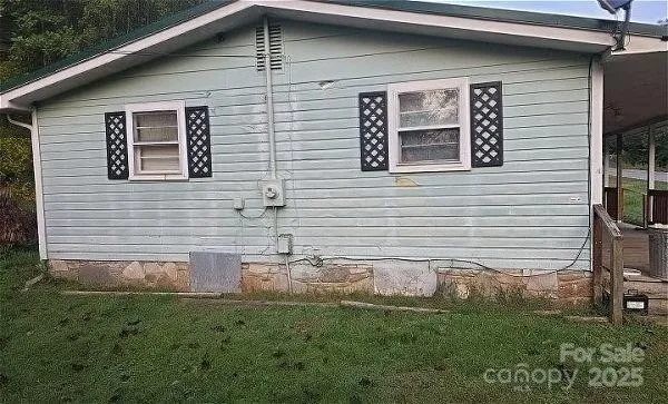 a view of a backyard of the house