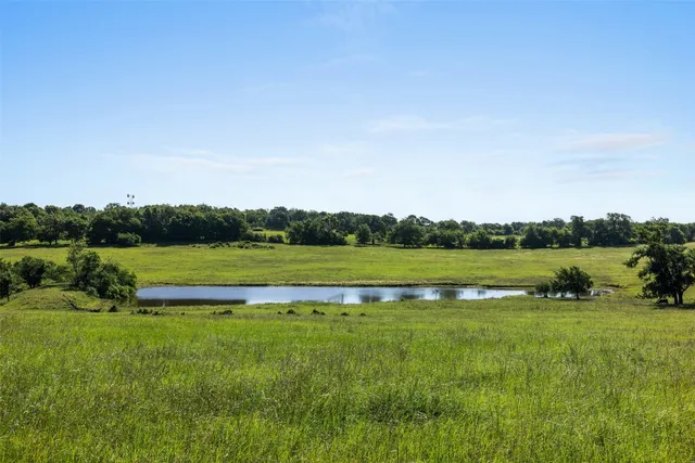 a view of a golf course with a lake