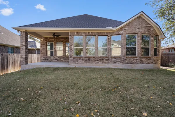 a view of a backyard of the house