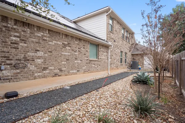 a house with trees in the background