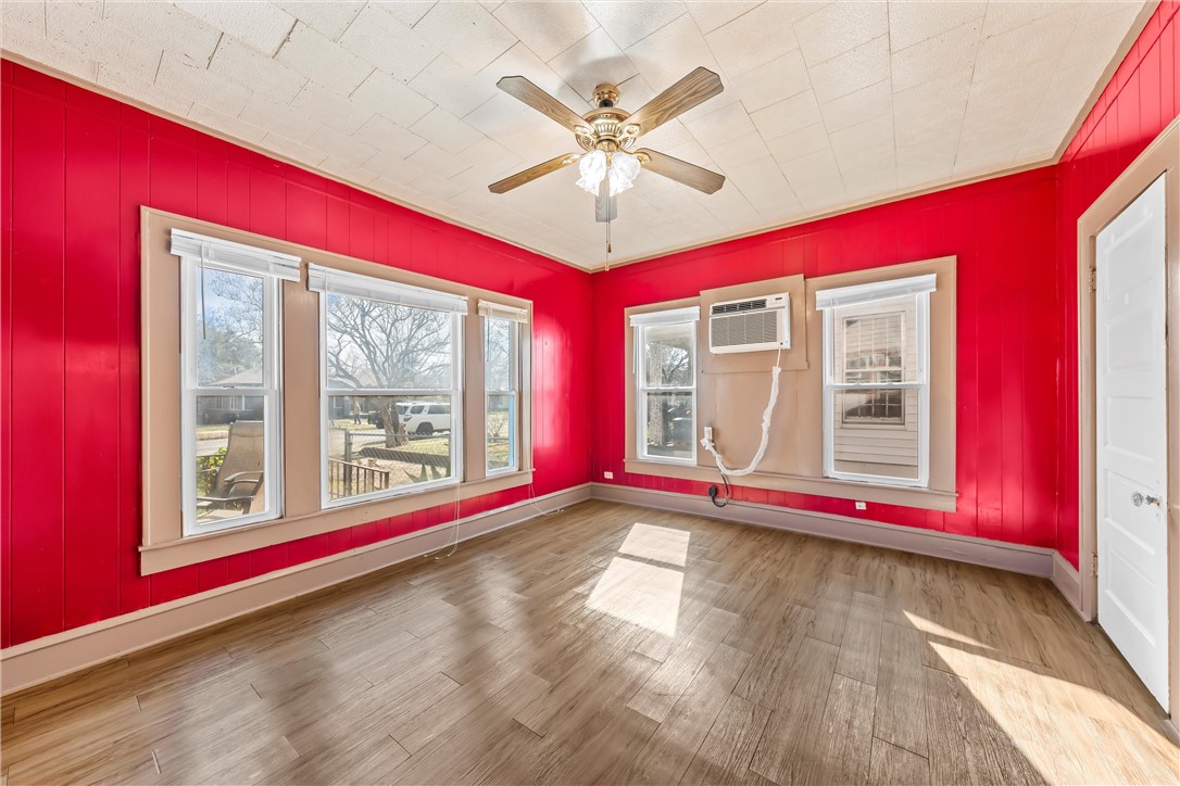 2721 Morrow Avenue Waco, TX 76707 - Photo 23 of 44 a view of an empty room with wooden floor and a window