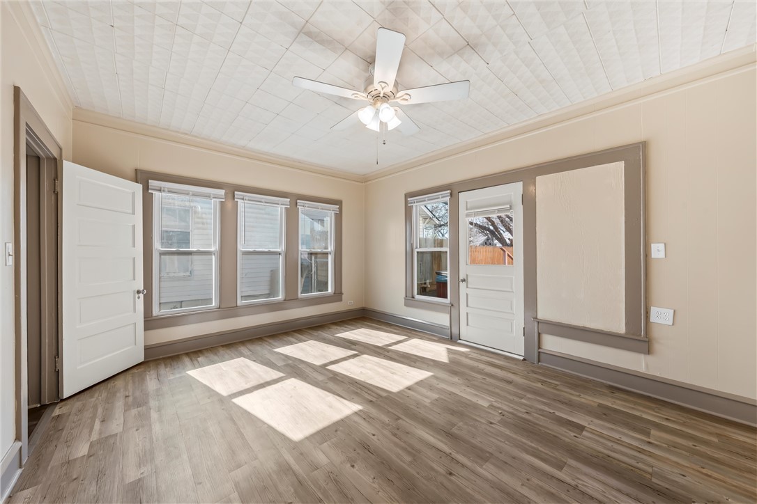 2721 Morrow Avenue Waco, TX 76707 - Photo 25 of 44 a view of empty room with wooden floor and fan