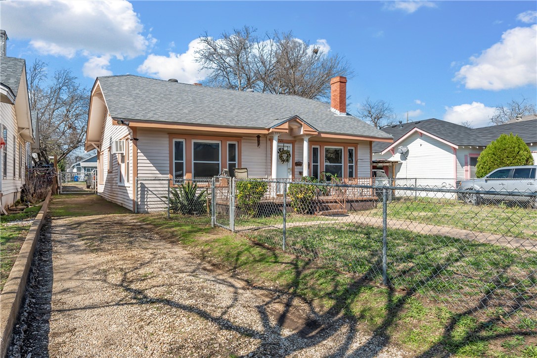 2721 Morrow Avenue Waco, TX 76707 - Photo 28 of 44 a front view of house with yard and trees in the background