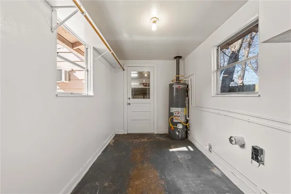 a view of hallway with stairs and wooden floor