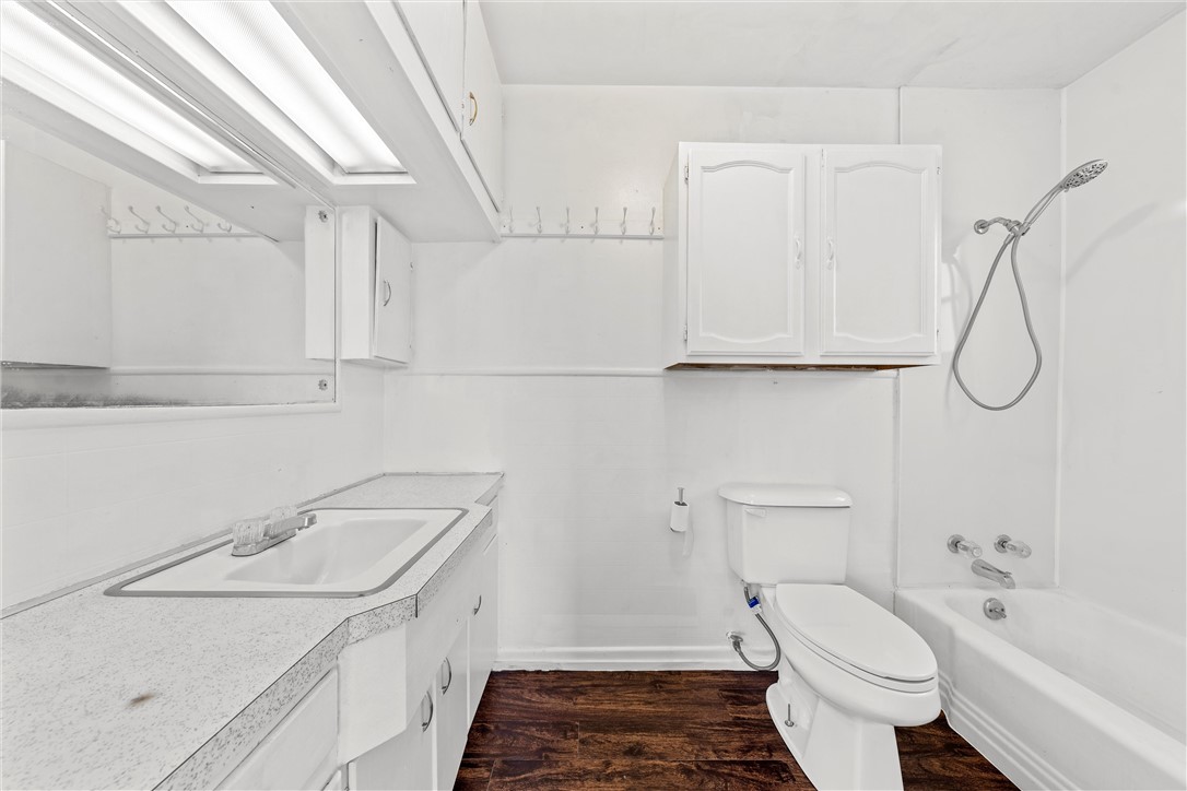 2721 Morrow Avenue Waco, TX 76707 - Photo 8 of 44 a bathroom with a sink a toilet and shower