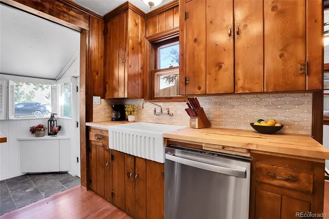 a kitchen with a sink and cabinets