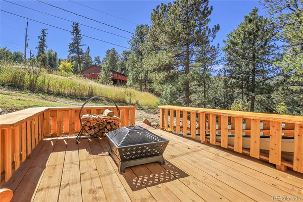 a view of wooden balcony with outdoor seating