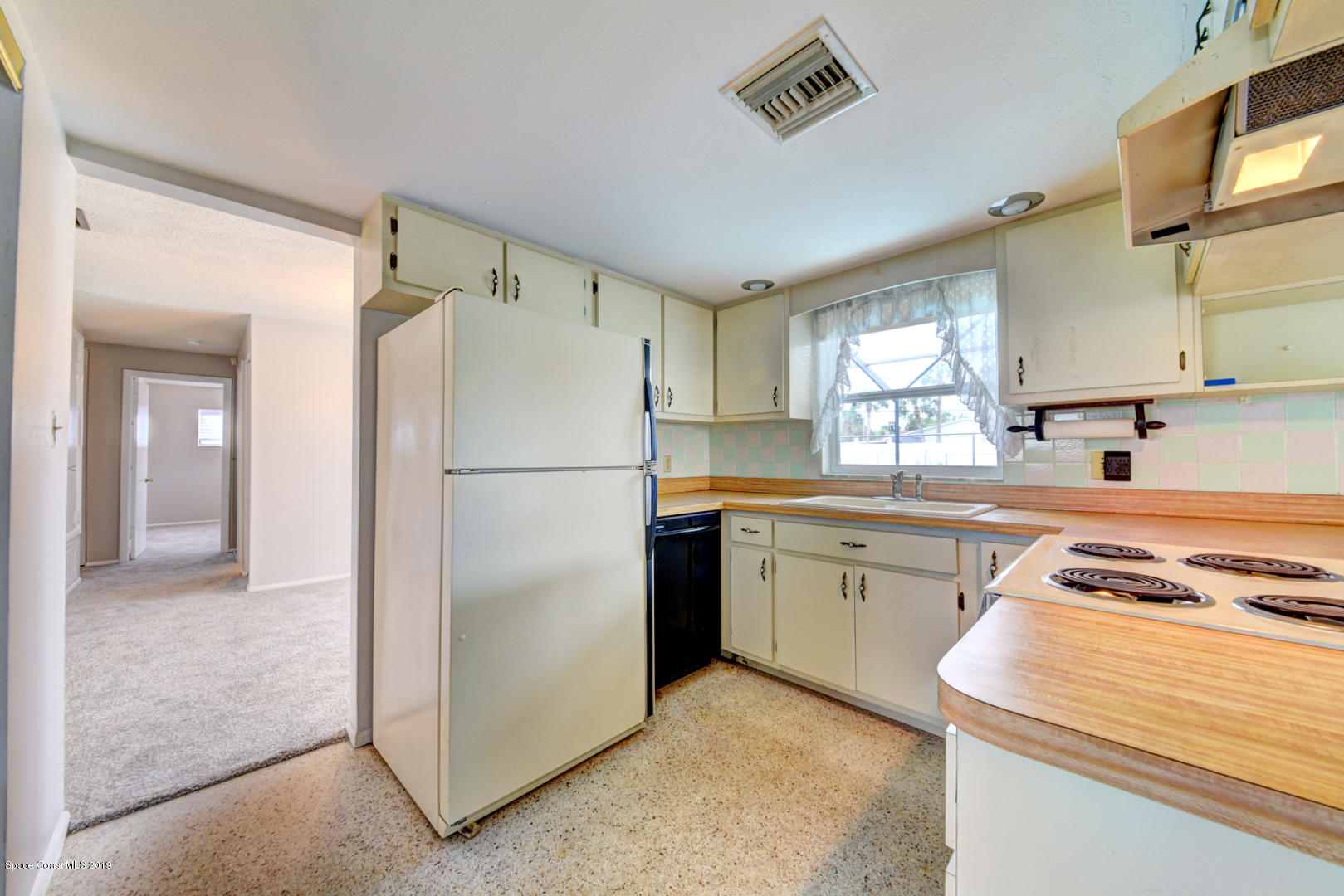 909 Jefferson Road Rockledge, FL 32955 - Photo 14 of 37 kitchen off dining room