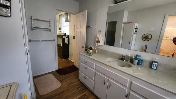 a bathroom with a double vanity sink and mirror