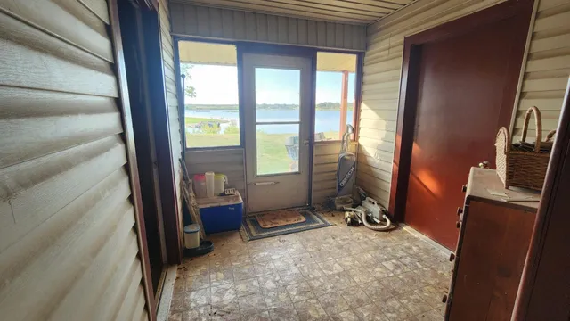 a view of a room with gym equipment and windows