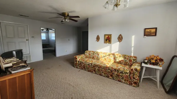 a bedroom with a bed and a television