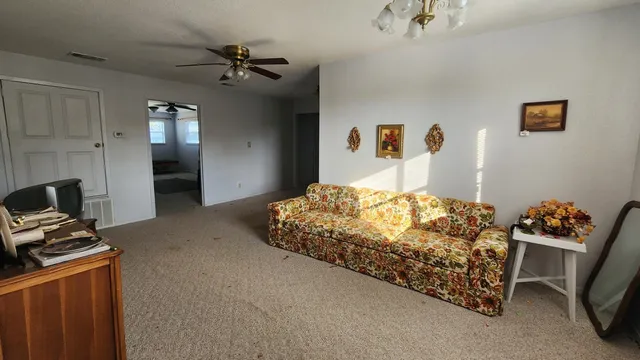 a bedroom with a bed and a television