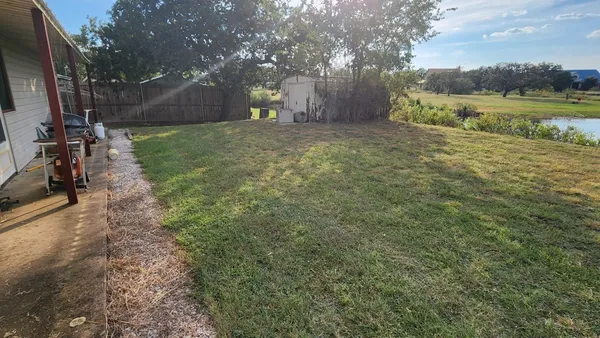 a view of a yard with an outdoor space