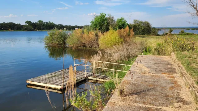 a view of a lake with houses in the background